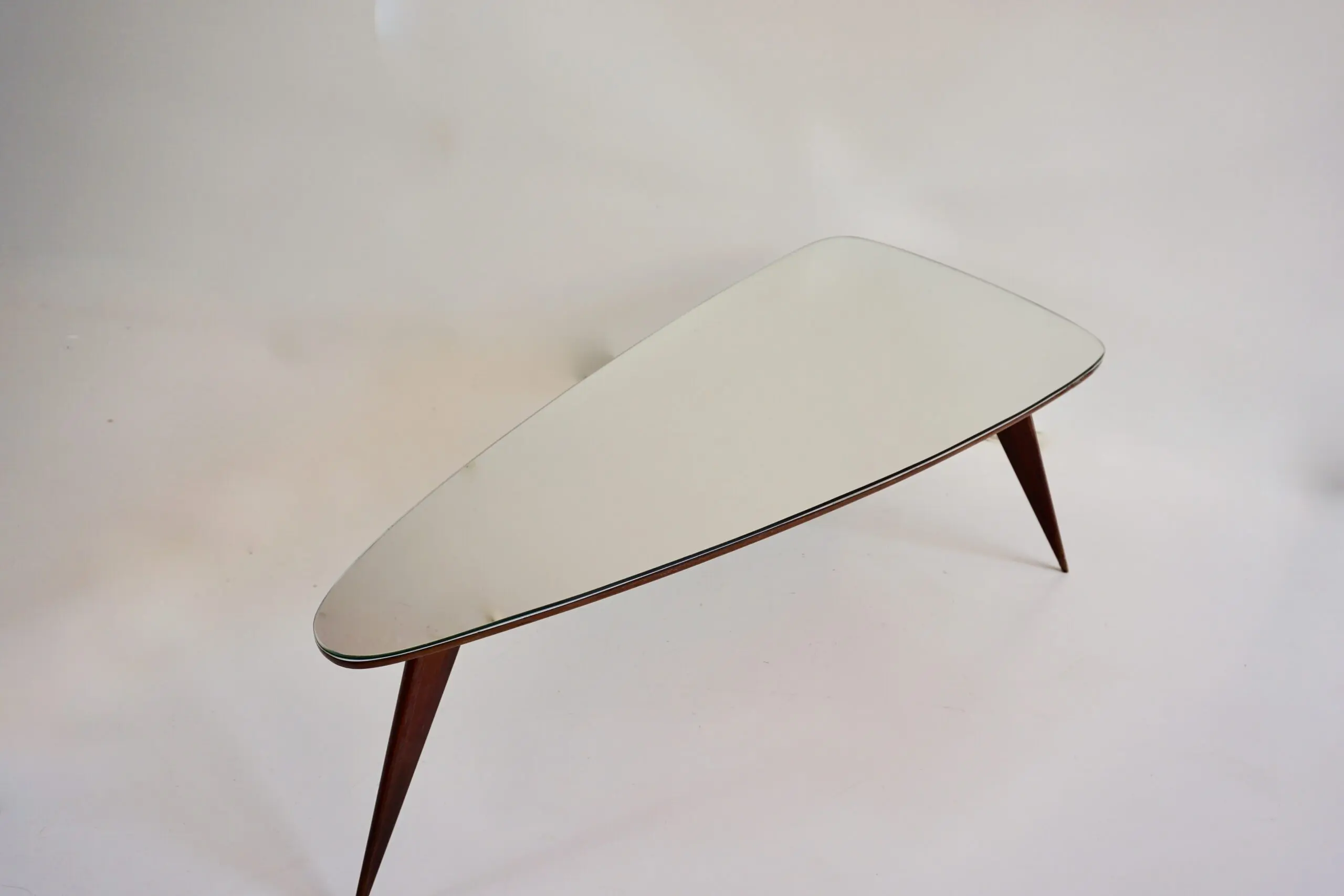 large Cesare Lacca walnut coffee table, three feet irregular shape, mirrored top — photo 5