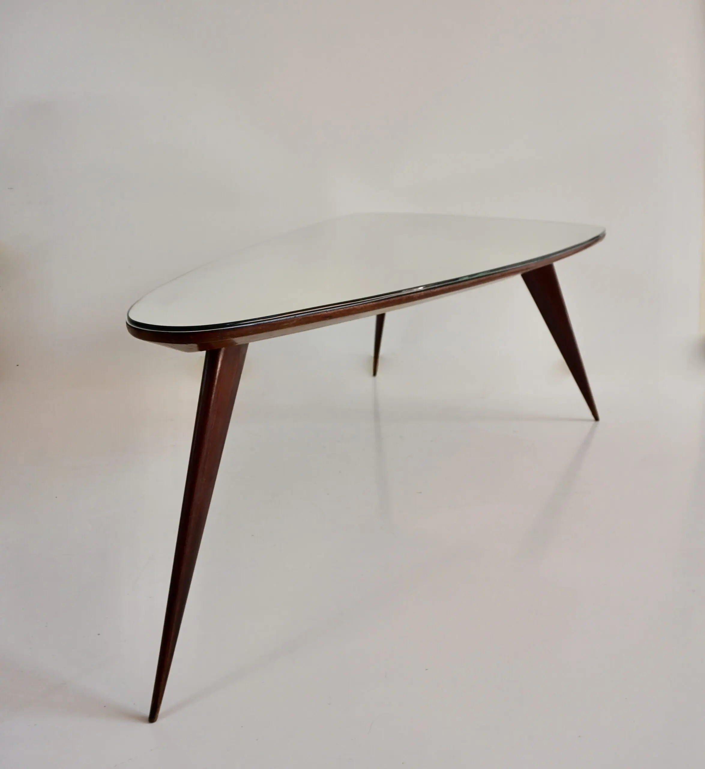 large Cesare Lacca walnut coffee table, three feet irregular shape, mirrored top — image 3